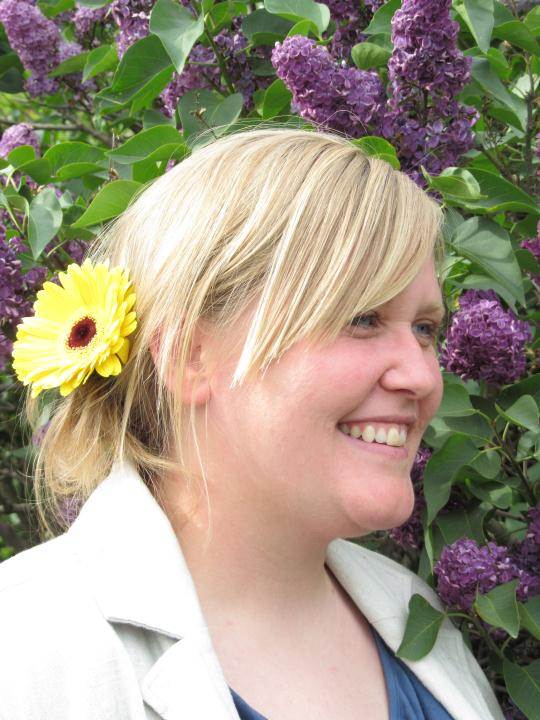 Erin with yellow gerbera and lilacs